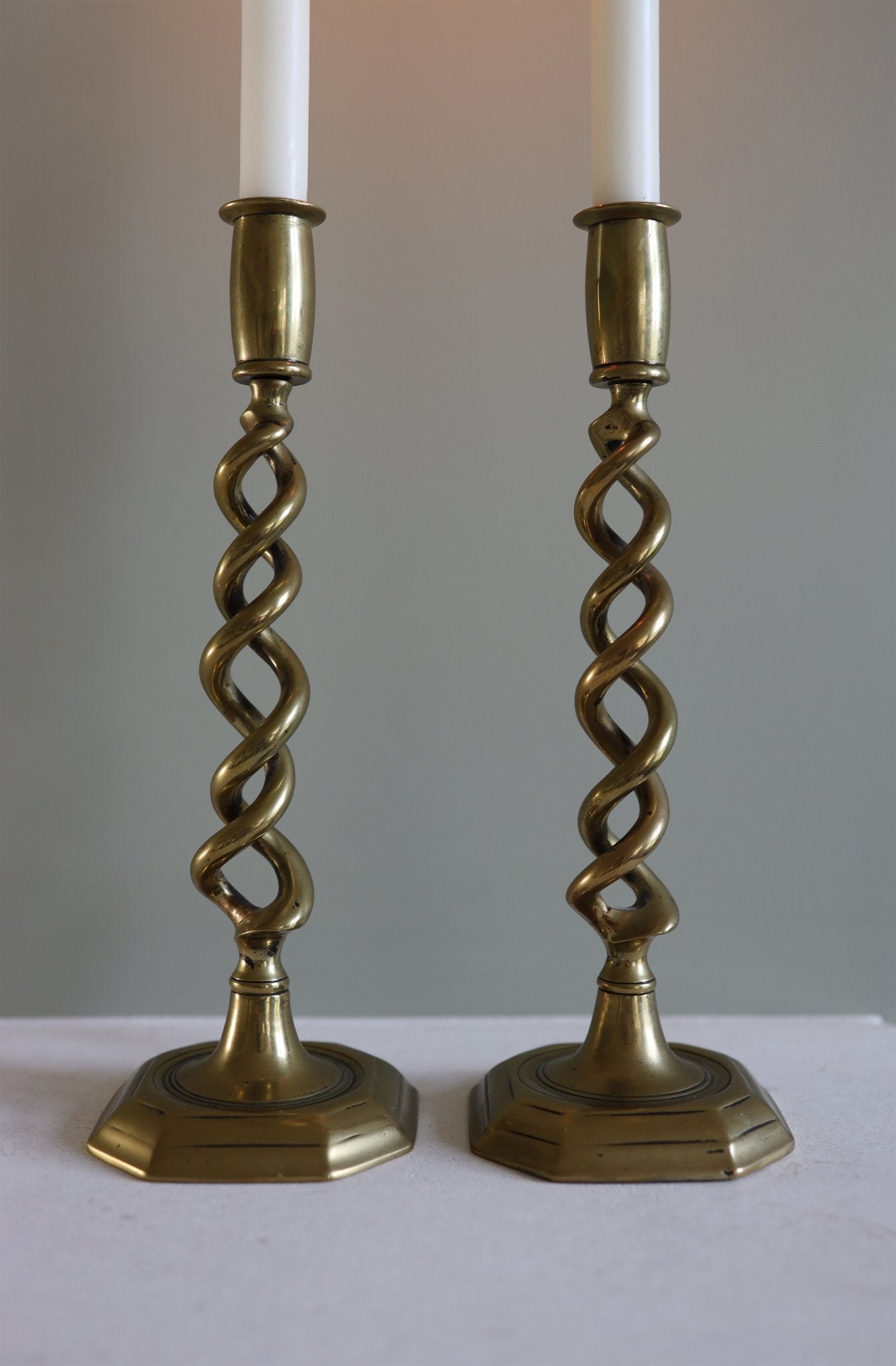 A pair of brass open twisted candle holders - Clementine Parker